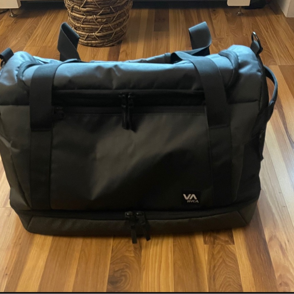 Spacious, rugged RVCA carry on bag for traveling. Fits clothes for 10 day trip.